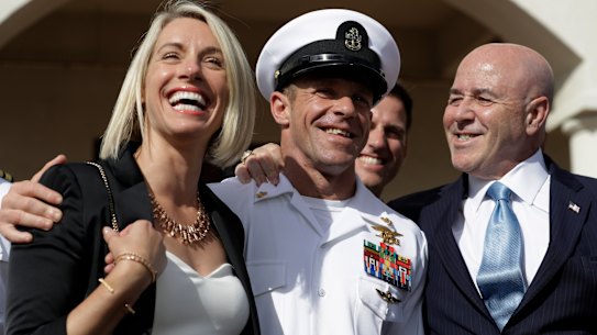 Chief Petty Officer Edward Gallagher, centre, with his wife Andrea as they leave a military court on Naval Base San Diego after his acquittal on all but one charge in July.