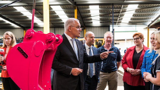 Prime Minister Scott Morrison and Treasurer Josh Frydenberg talk about a pink digger bucket being sold for charity.