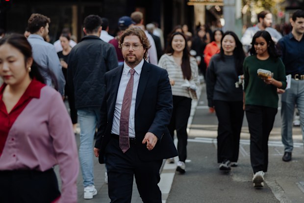 Pedestrians and office workers roam the Sydney CBD. 