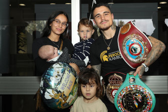 Kambosos with wife Rebecca 
and their three children. She quit university to help him follow his boxing dreams. 
