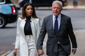 Boris Becker arrives at the court with his girlfriend for his sentencing hearing.
