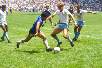 Maradona takes on England's Terry Butcher and Kenny Sansom in the 1986 FIFA World Cup quarter final.
