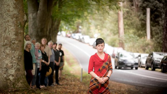 Peta Freeman (in red) and other Dandenongs locals protesting the scale of the  redevelopment and possible removal of heritage trees earlier this year.