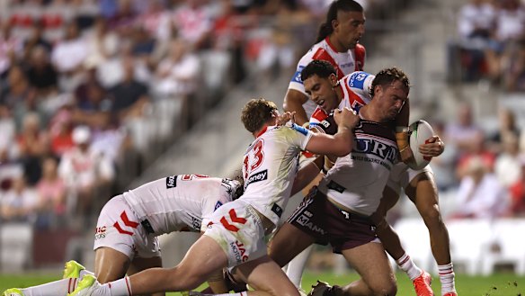 The Dragons tackle Manly’s Kobe Hetherington.