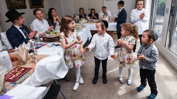 Rabbi Yoni Fisher and his family celebrate Passover as looser restrictions have put this family more at ease. 