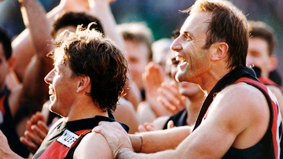 Premiership teammates: Mark Thompson and Tim Watson celebrate their 1993 flag.