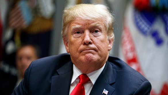 President Donald Trump listens to a question from a reporter during a meeting of the President's National Council of the American Worker in the Roosevelt Room of the White House.