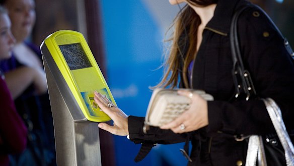 Passenger using a myki card at Clifton Hill station.