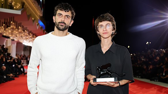 Israeli directors Yuval Abraham and Rachel Szor with the special jury prize award they won for Naza at the Venice Film Festival.