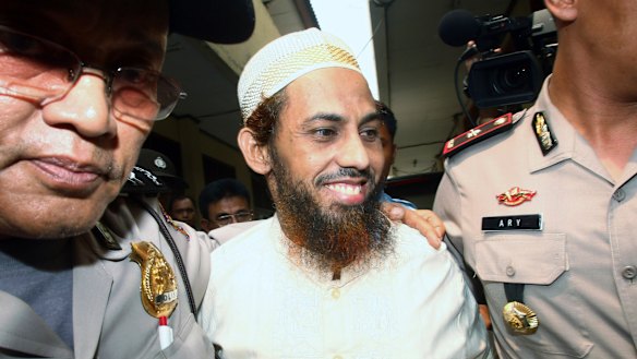 Umar Patek is escorted to court in Jakarta in 2011.