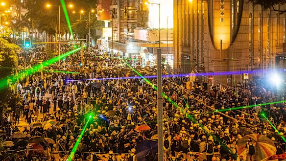 Pro-democracy protesters shine laser pointers during a clash at Admiralty district in Hong Kong on August 31.
