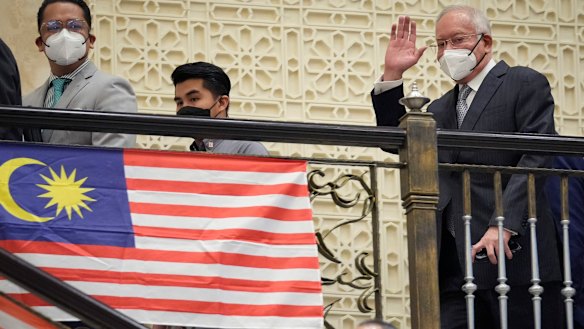 Najib Razak waves to supporters as he arrives at court for his final appeal in August. 