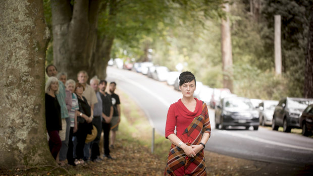 Peta Freeman (in red) and other Dandenongs locals protesting the scale of the  redevelopment and possible removal of heritage trees earlier this year.