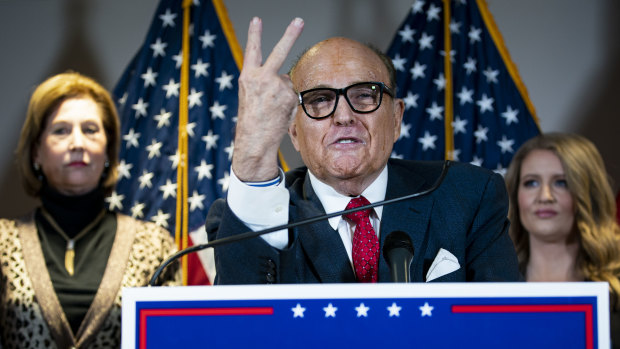 Rudy Giuliani, personal lawyer to US President Donald Trump, spreads a conspiracy theory during a press conference.