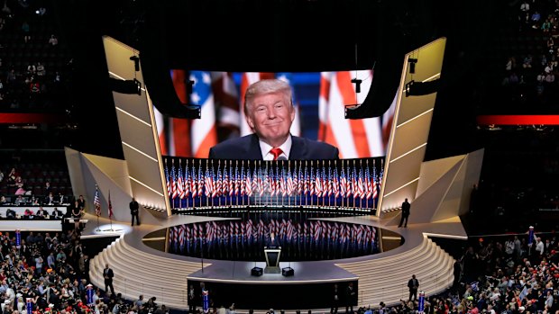 Republican presidential candidate Donald Trump smiles as he addresses delegates during the final day session of the Republican National Convention in Cleveland in 2016.