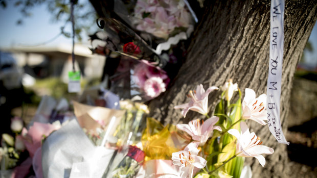 Flowers at the site of the crash that killed Matt Goland and Bita Zaeim in Wantirna South.