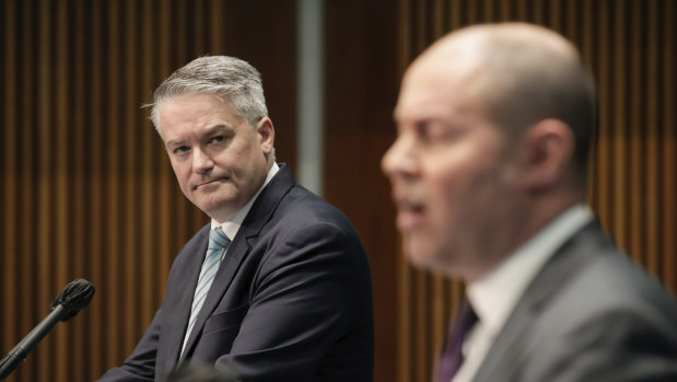 Finance Minister Mathias Cormann, left, and Treasurer Josh Frydenberg deliver the economic statement in Canberra on Thursday.