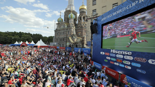 Box seats: A huge crowd watches the opening match of the 2018 World Cup between Russia and Saudi Arabia, screened at a fan zone in St.Petersburg.