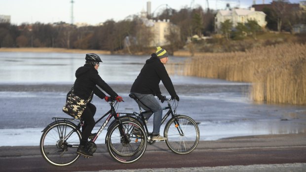 Cyclists enjoy a sunny New Year's Day in Helsinki.