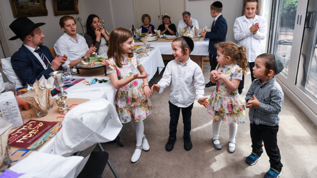 Rabbi Yoni Fisher and his family celebrate Passover as looser restrictions have put this family more at ease. 