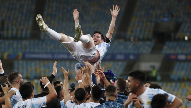 Lionel Messi is lifted by teammates after the Copa America final in Rio in 2021.