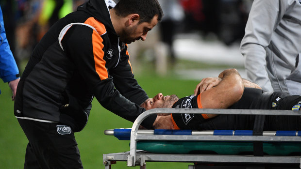 Robbie Farah being stretchered off the field.