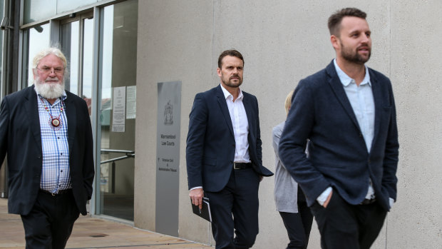 Geoff Clark outside court with his sons Jeremy and Aaron earlier this year.