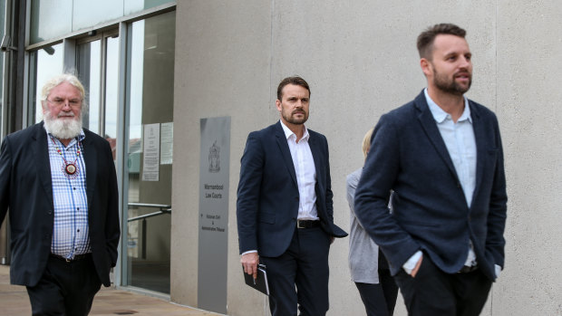 Geoff Clark outside court with his sons Jeremy and Aaron. 