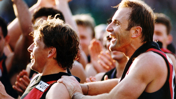 Premiership teammates: Mark Thompson and Tim Watson celebrate their 1993 flag.