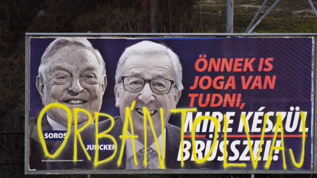 A billboard from a campaign of the Hungarian government showing EU Commission President Jean-Claude Juncker and Hungarian-American financier George Soros with the caption "You, too, have a right to know what Brussels is preparing to do." 