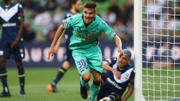 The Perth Glory’s Ciaran Bramwell celebrates a goal against the Melbourne Victory at AAMI Park.