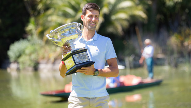 Sweet victory: Novak Djokovic poses with the Australian Open trophy.
