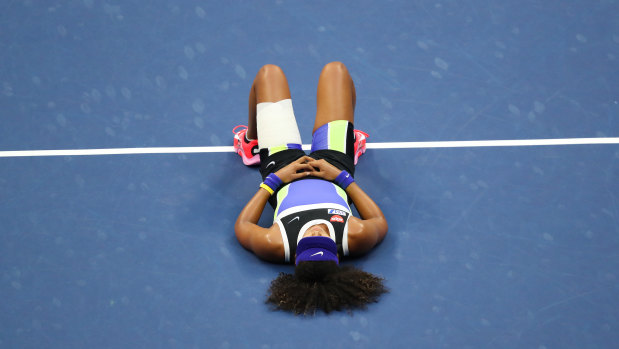 Naomi Osaka of Japan lays down in celebration after winning her Women's Singles final match against Victoria Azarenka of Belarus on Day Thirteen of the 2020 US Open at the USTA Billie Jean King National Tennis Center on September 12, 2020 in the Queens borough of New York City.