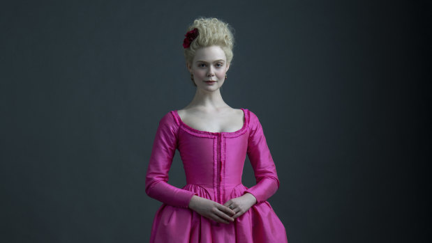 Fanning, pretty in pink, as Catherine the Great, Empress of Russia.