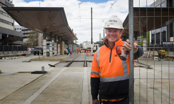 Light rail construction worker, Ross Gothard, at the close-to-complete station at Alinga Street.