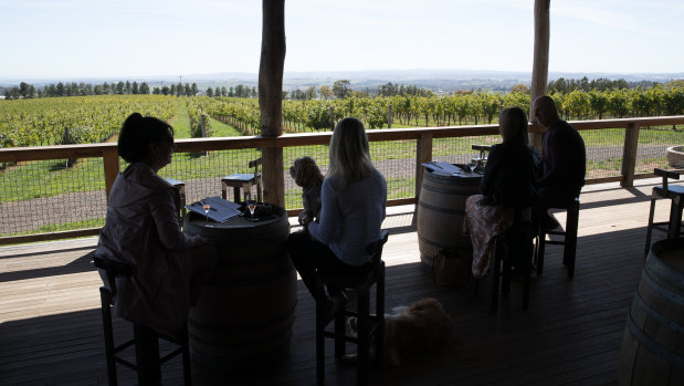 Customers at De Salis Wines are separated as per the government's guidelines.