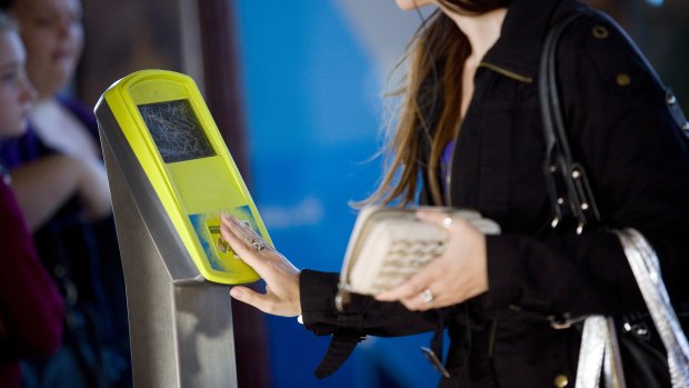 Passenger using a myki card at Clifton Hill station.