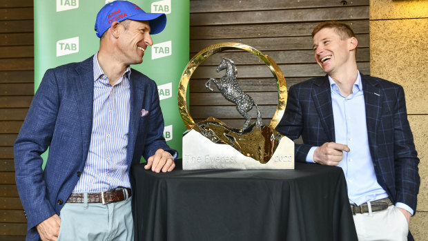 Jockeys Hugh Bowman (Lost And Running) and James McDonald (Nature Strip) with The Everest trophy.