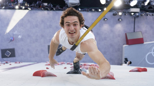 Adam Ondra, of the Czech Republic, participates during the speed qualification section of the men’s sport climbing.