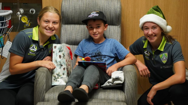 Canberra United players took a break from training to deliver Christmas gifts at the Centenary Hospital for Women and Children on Tuesday. 