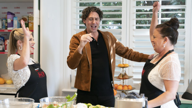 MKR contestants Jenni and Louise in the kitchen with Colin Fassnidge.