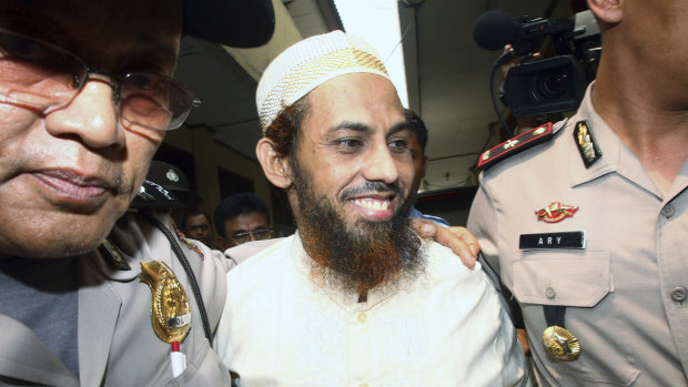 Umar Patek is escorted to court in Jakarta in 2011.