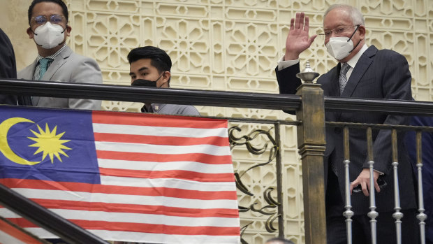 Najib Razak waves to supporters as he arrives at court for his final appeal in August. 