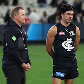 Hollands (right) with then-Blues coach Michael Voss after the loss to Collingwood.