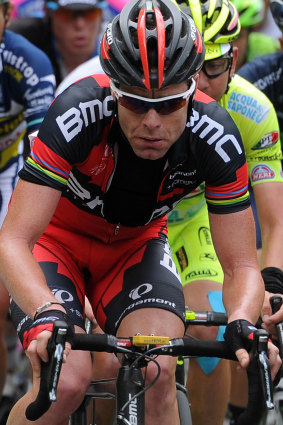 Cadel Evans in his team kit in 2014, with rainbow stripes on his sleeve.