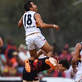 Spectacular: Eddie Betts flies high over former Adelaide teammate Jake Lever.