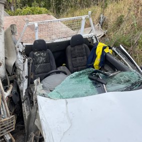 Firefighters had to cut the roof off this ute to free the driver.