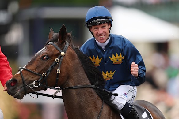 John Allen smiles after winning the VRC Oaks on Strictly Business.