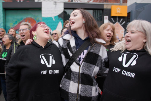 Eleanor Chadwick (centre) joining fellow Pop Choir members at the end of the music video.