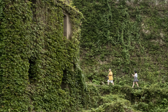 Tourists walk around Houtouwan Village this week.